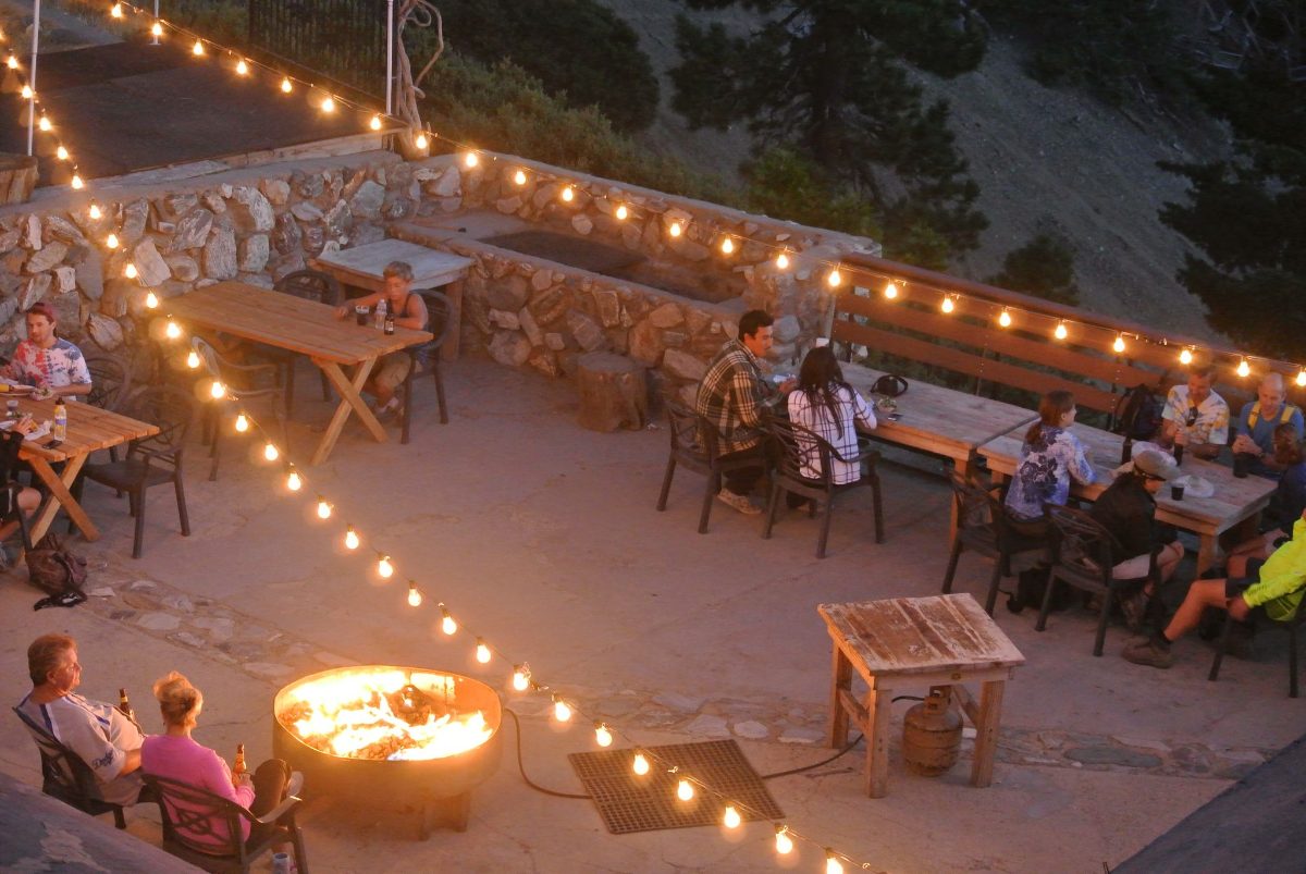 Fire pits under string lights on the Notch deck
