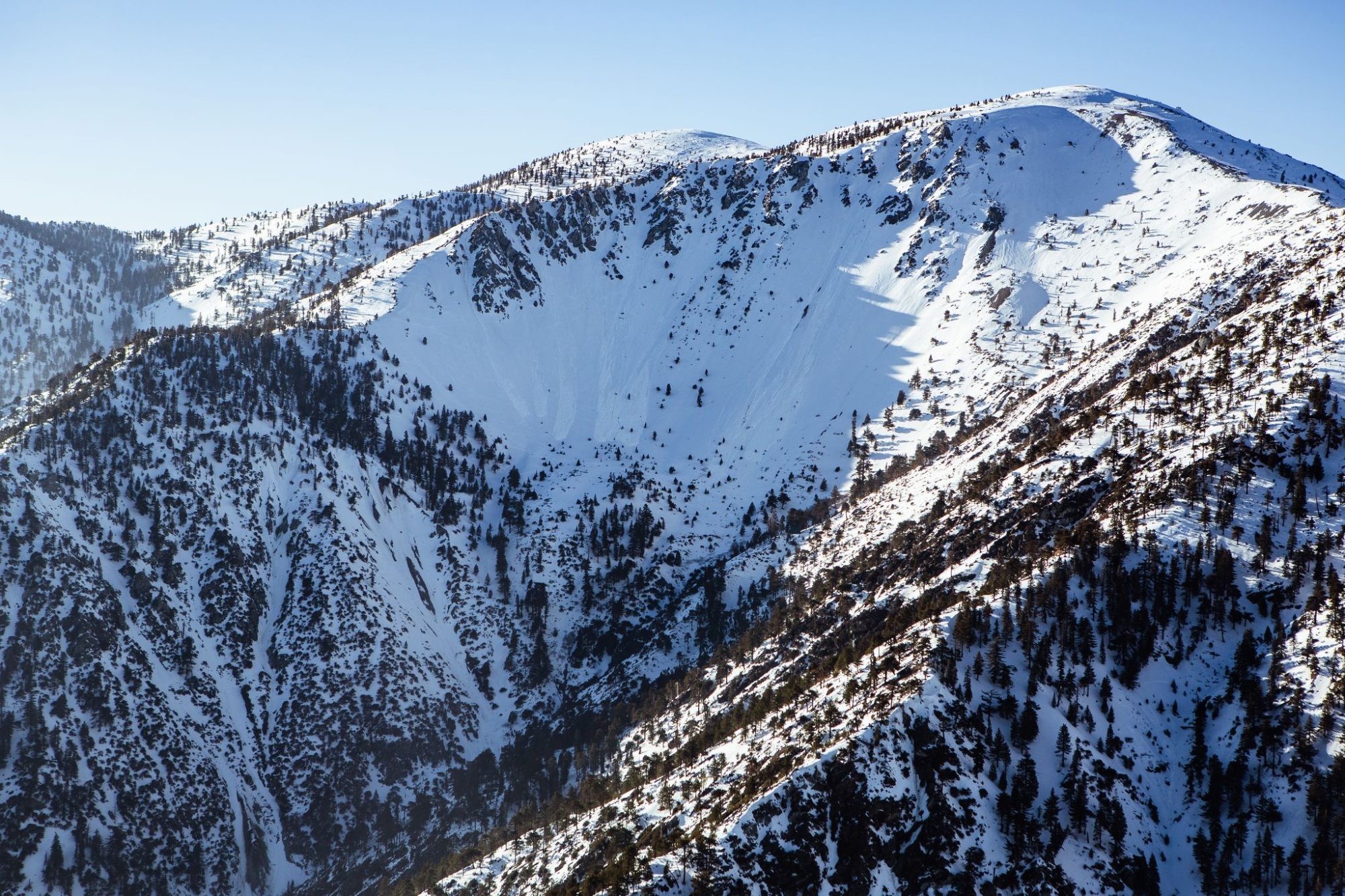 Snowy peaks of Mt Baldy under a blue sky