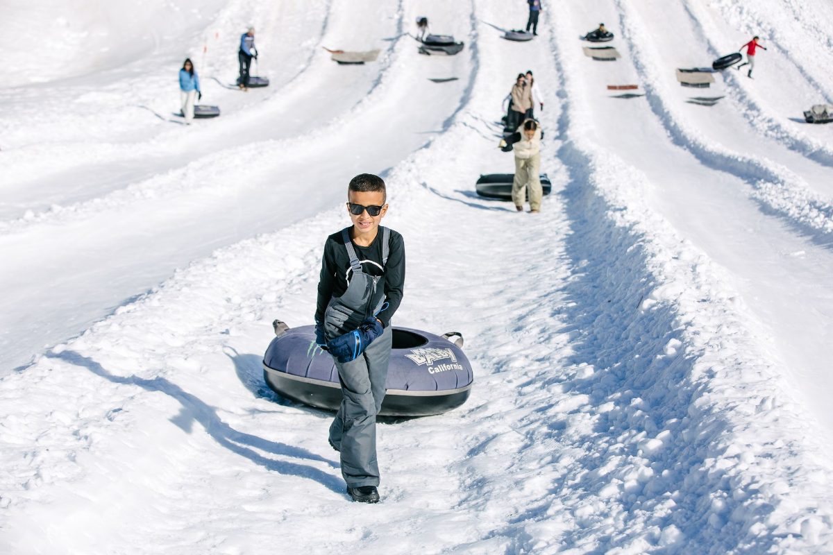 A rider heading down the tubing lanes