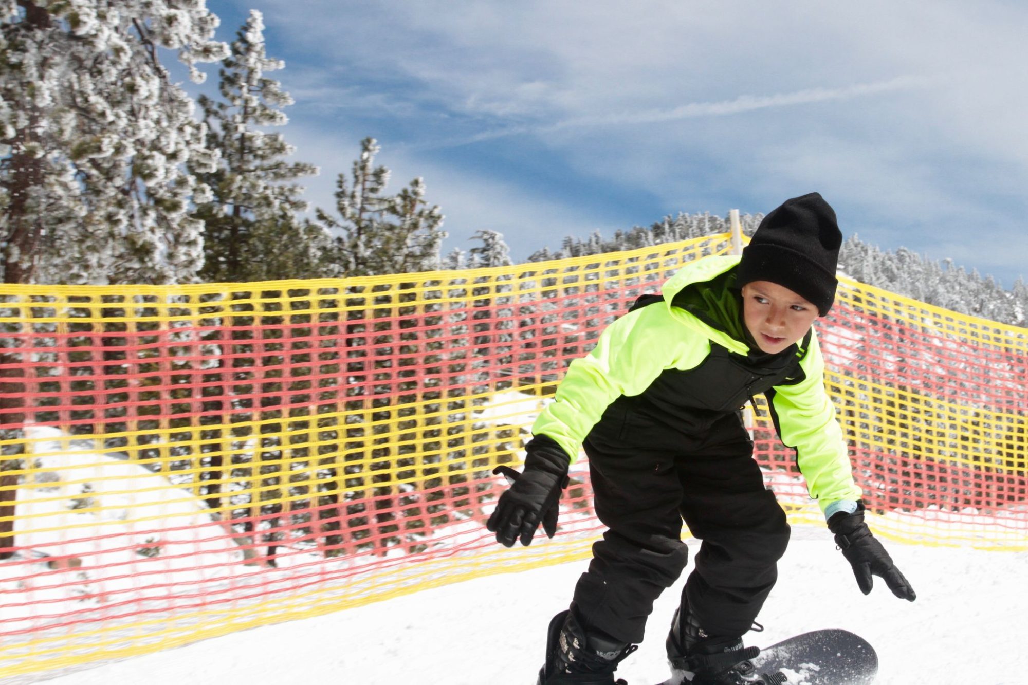 A kid in a ski lesson on the learning slope
