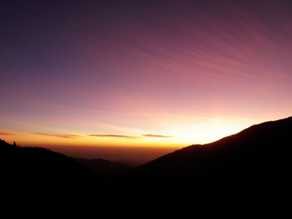 A purple and orange sunset over the mountains