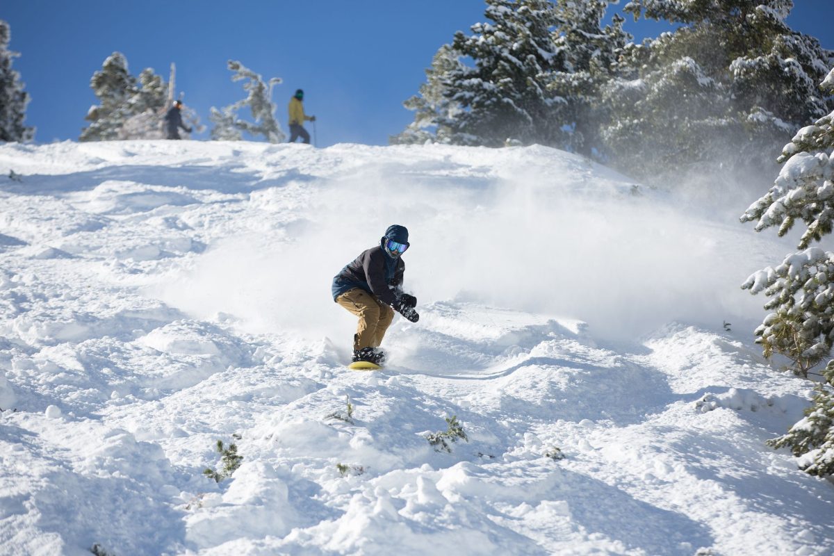 A skier on a groomed run