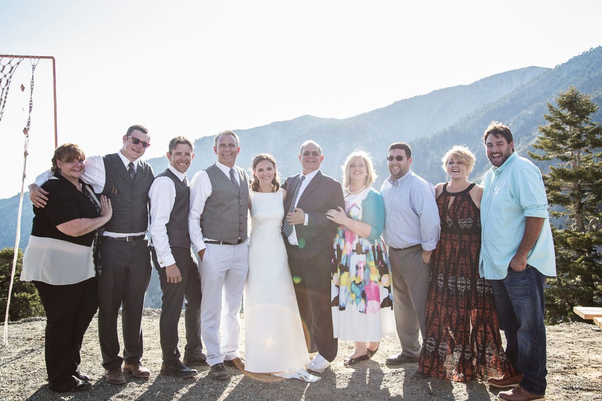 A wedding party gathered on the mountain