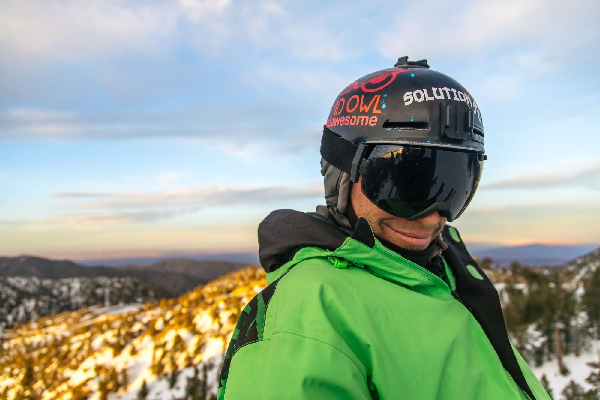 A Mt Baldy crew member in goggles at sunset