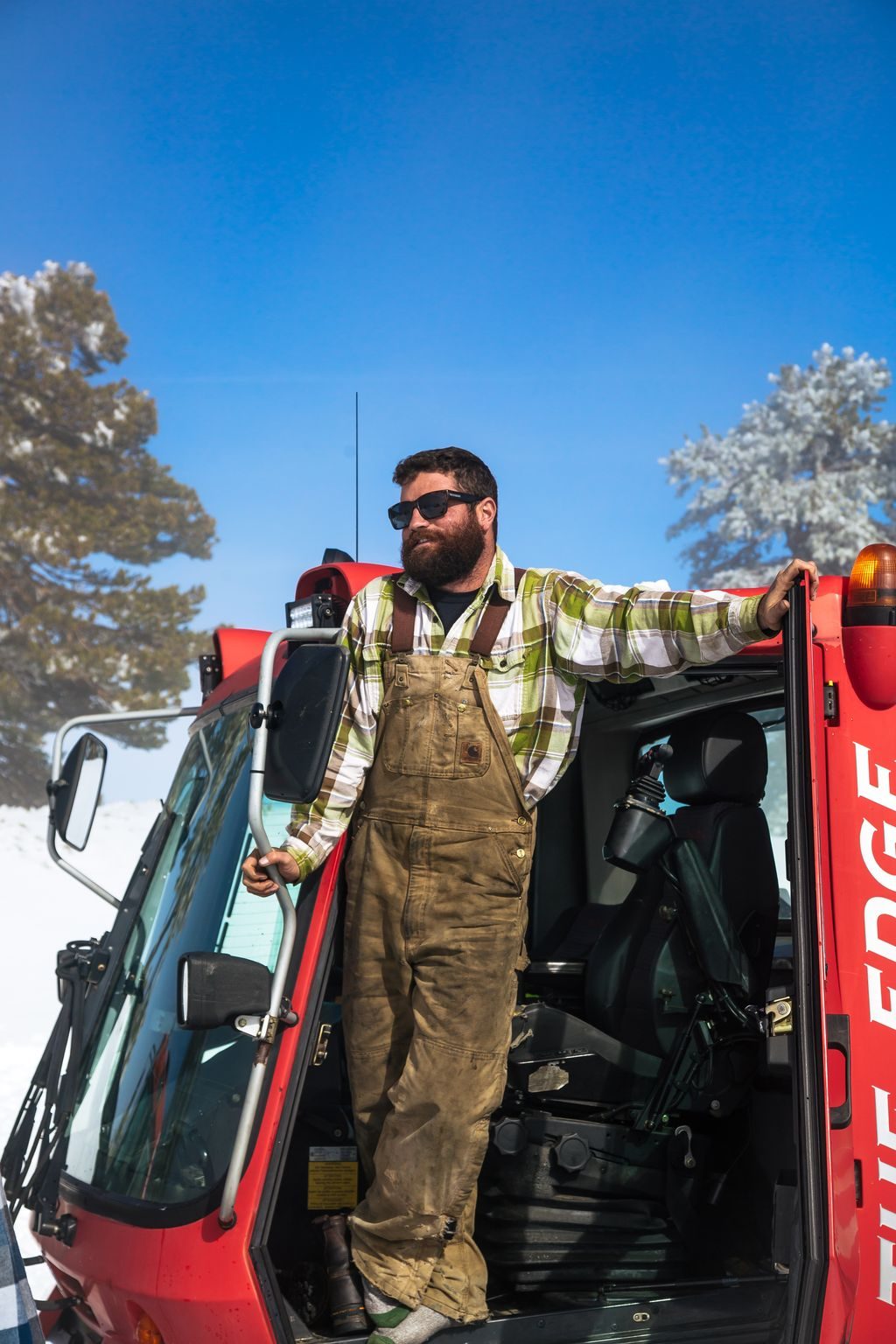 A snowcat operator at work