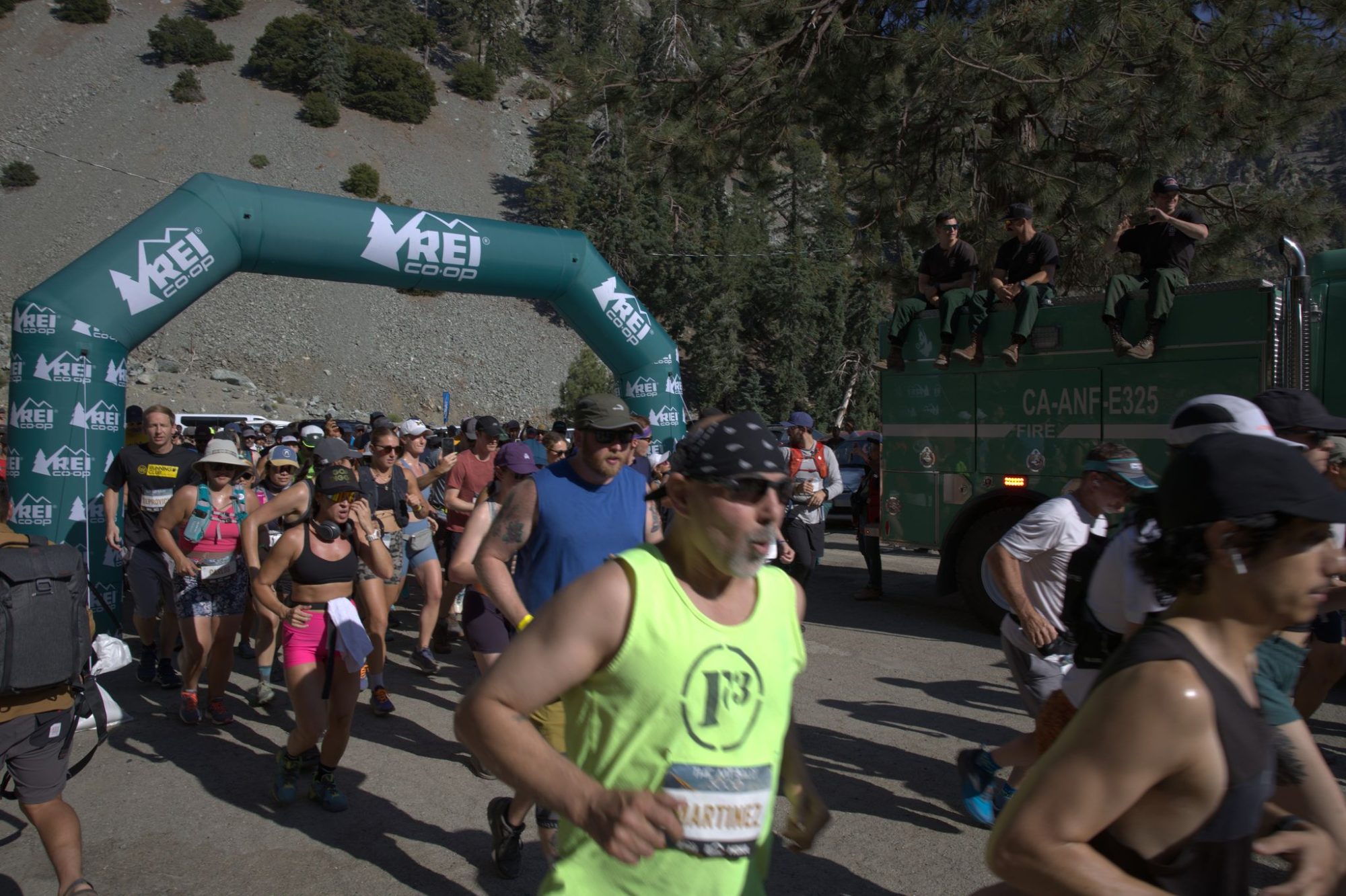 Run to the Top runners at the start arch