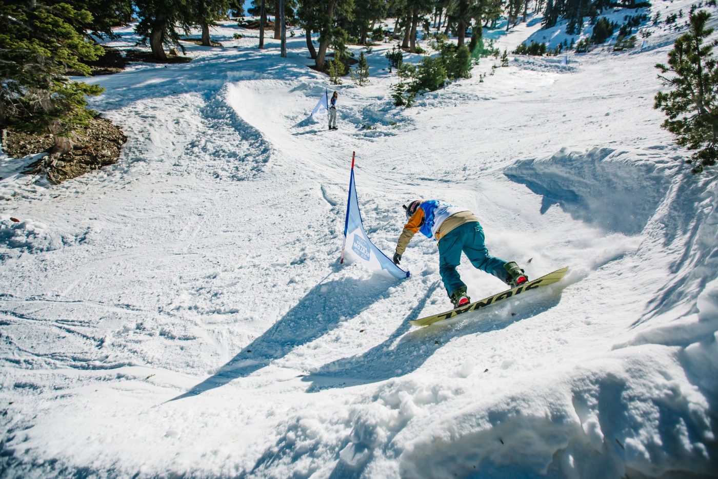 A rider launching off a berm on the Banked Slalom course