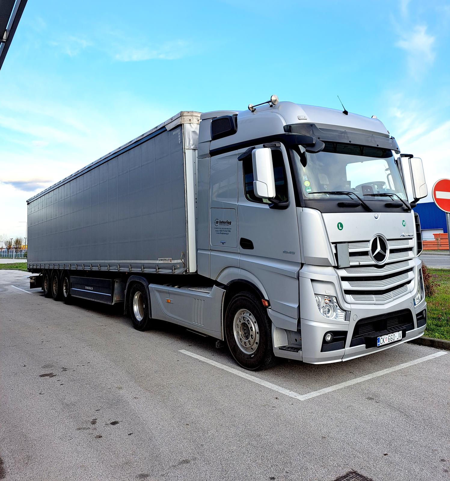 Interlog Silver Mercedes Truck