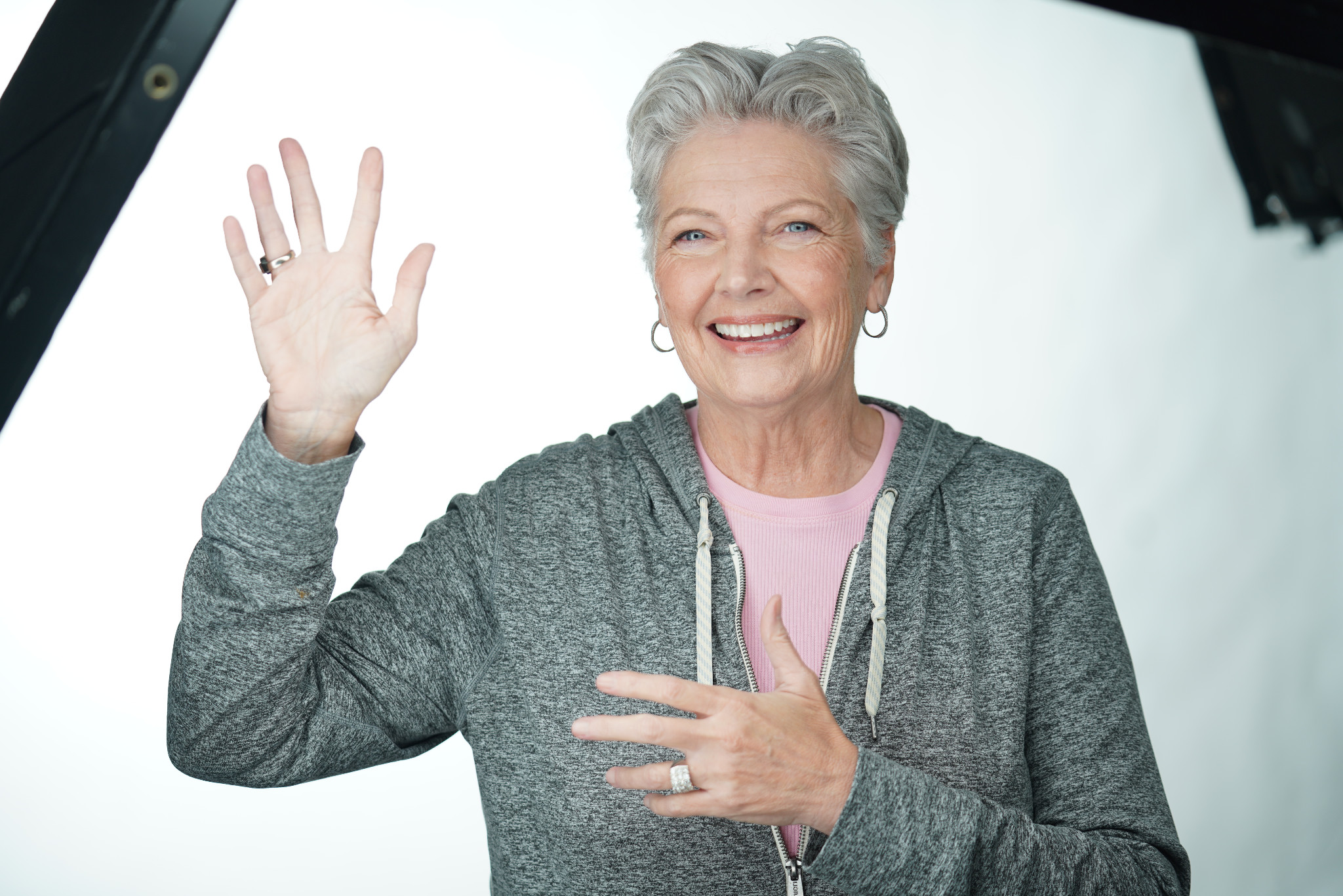 Tonja Demoff smiling and waving