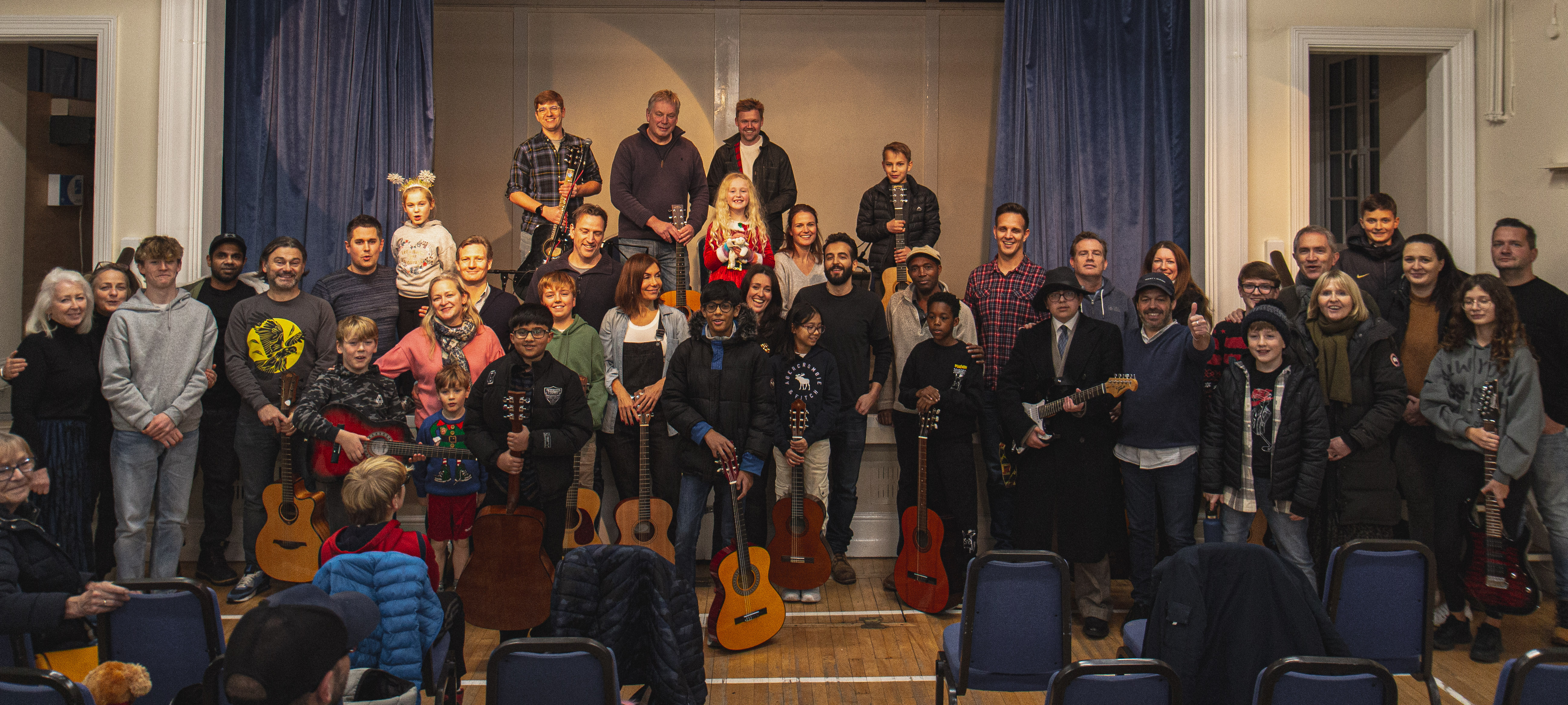 Guitar Journey students and families together at a concert