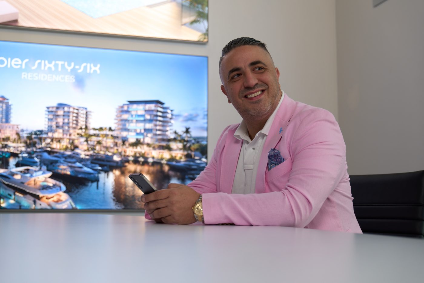 Alain Tapiero reviewing a development at his desk