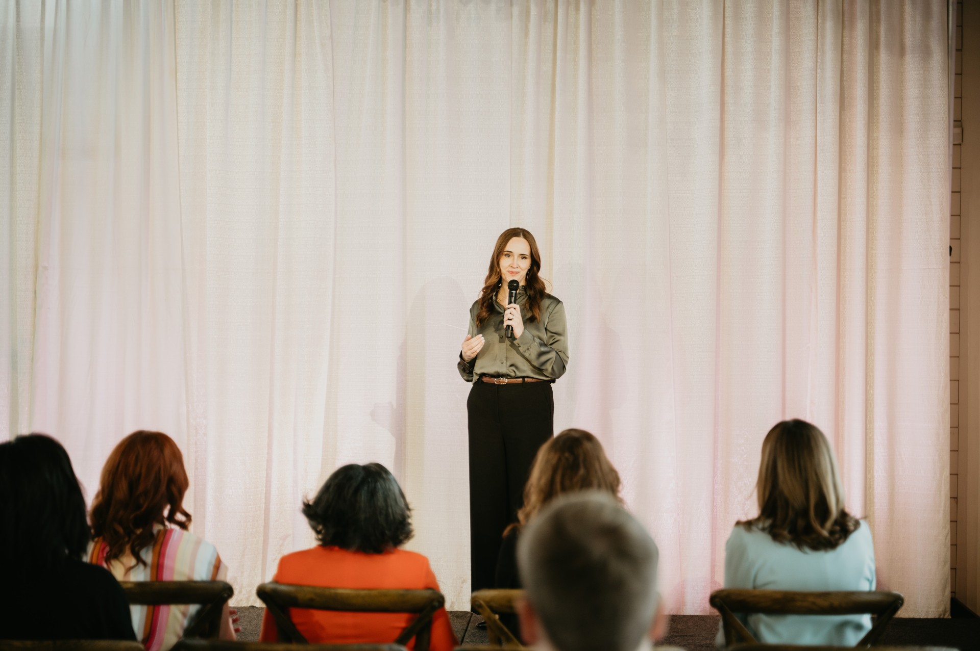 Daria Malin delivering a dynamic keynote presentation on sales and marketing