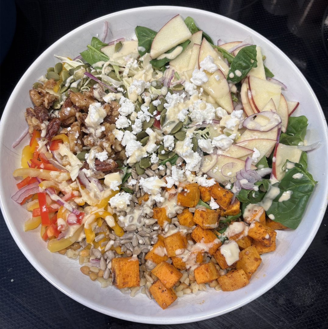 Nourishing Buddha bowl with roasted sweet potato, bulgur, green lentils, fresh greens, apple, seeds, pecans, feta and homemade lemon tahini dressing — a Magic Plate balanced meal by Sarativity holistic nutritionist Sara Tam"