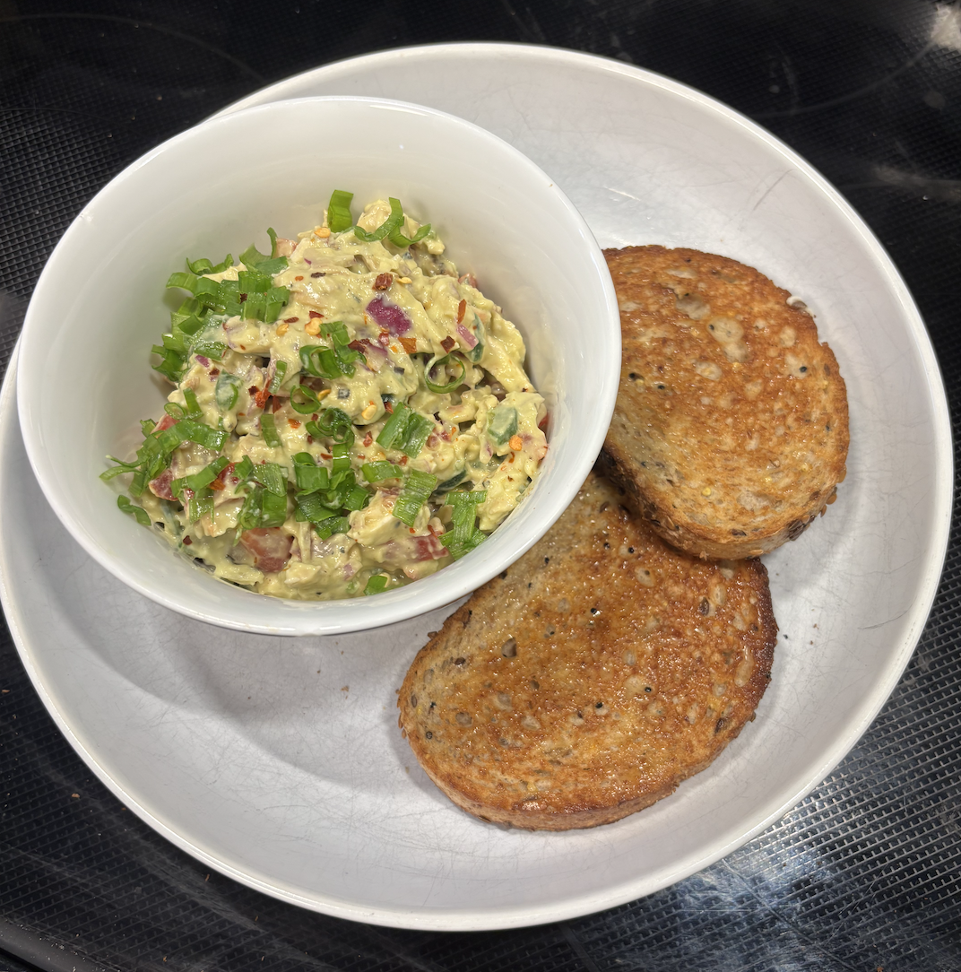 Creamy Avocado Chicken Salad with Sourdough Toast on plate Creamy Avocado Chicken Salad with Sourdough Toast on plate