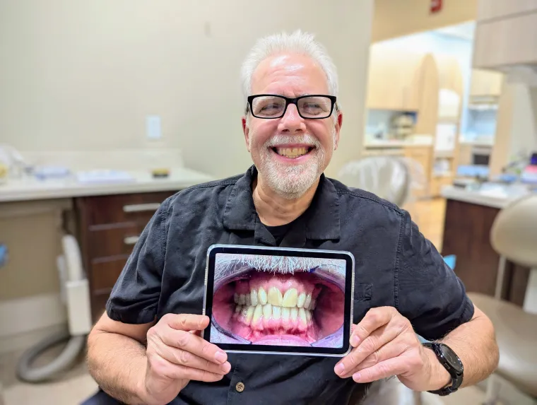 A Promenade Invisalign patient smiling with his finished scan
