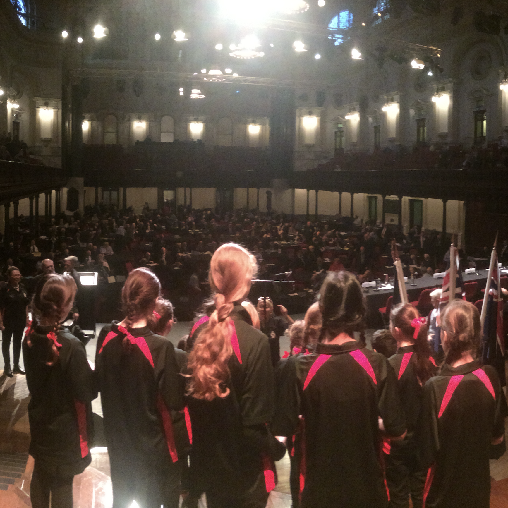 OZY Youth Choir children singing together on stage