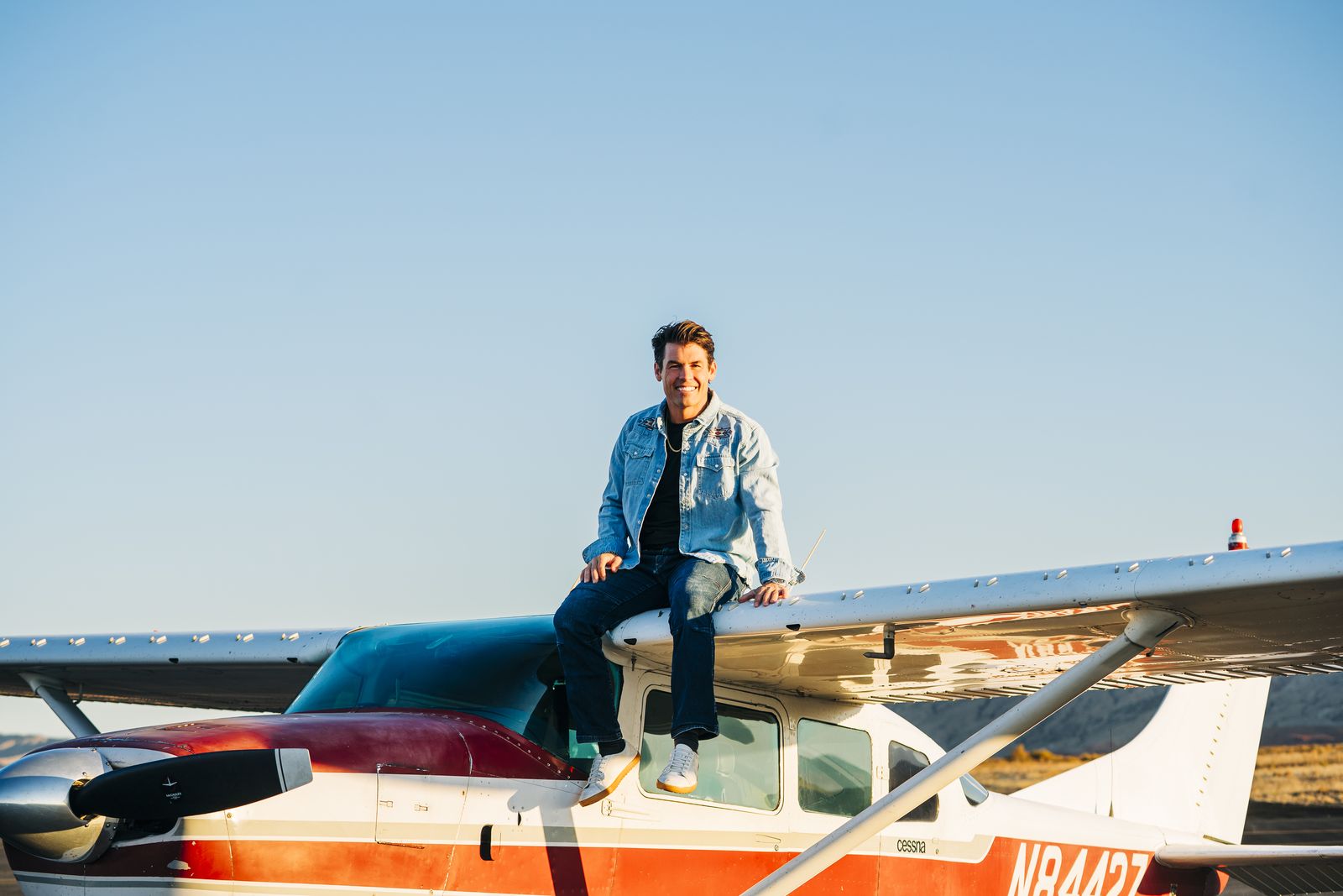 Bo Grant sitting on top of his plane