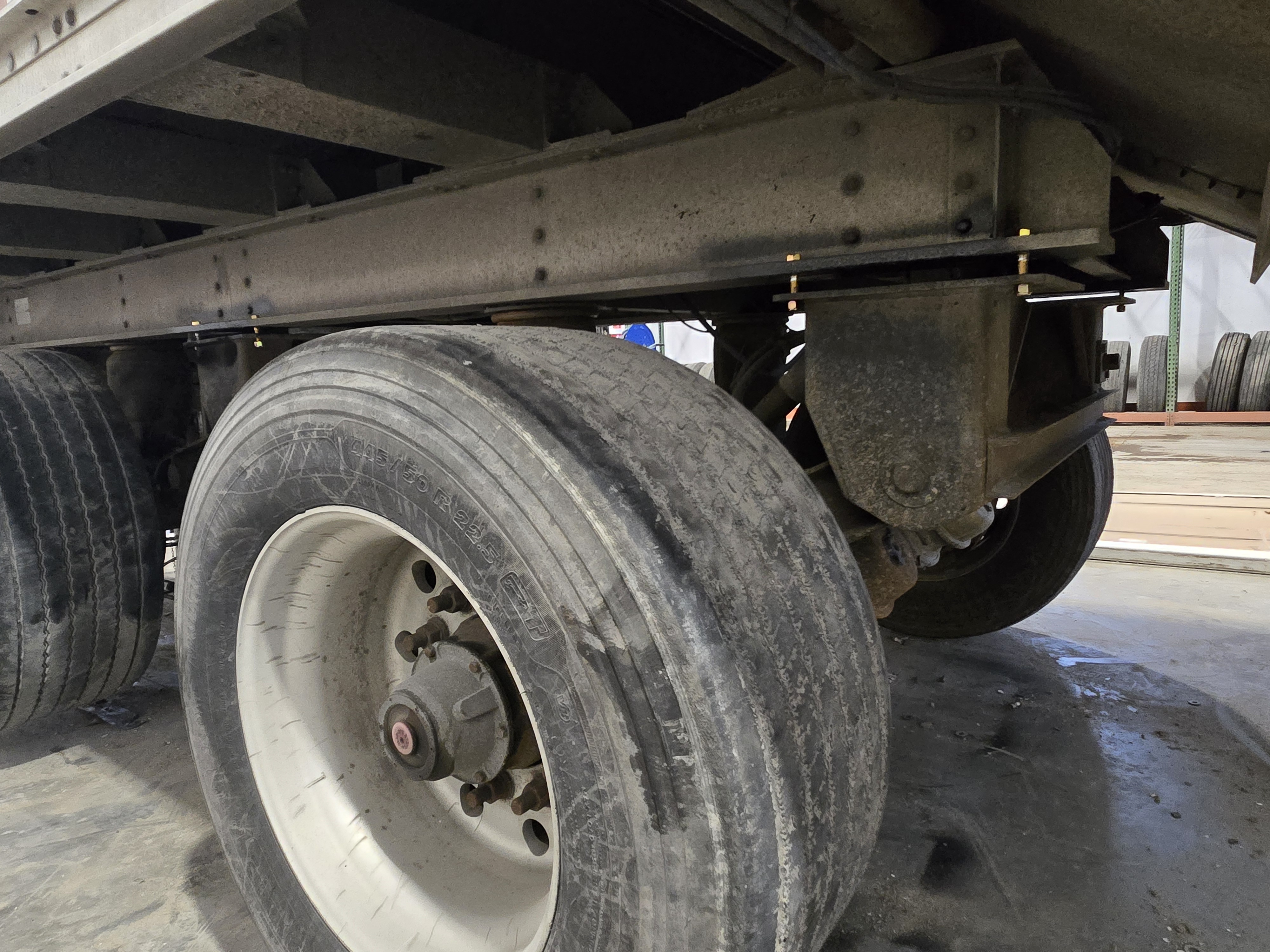 Galvanic corrosion between aluminum trailer frame and steel suspension hanger caused by road salt exposure. Galvanic corrosion between aluminum trailer frame and steel suspension hanger caused by road salt exposure.