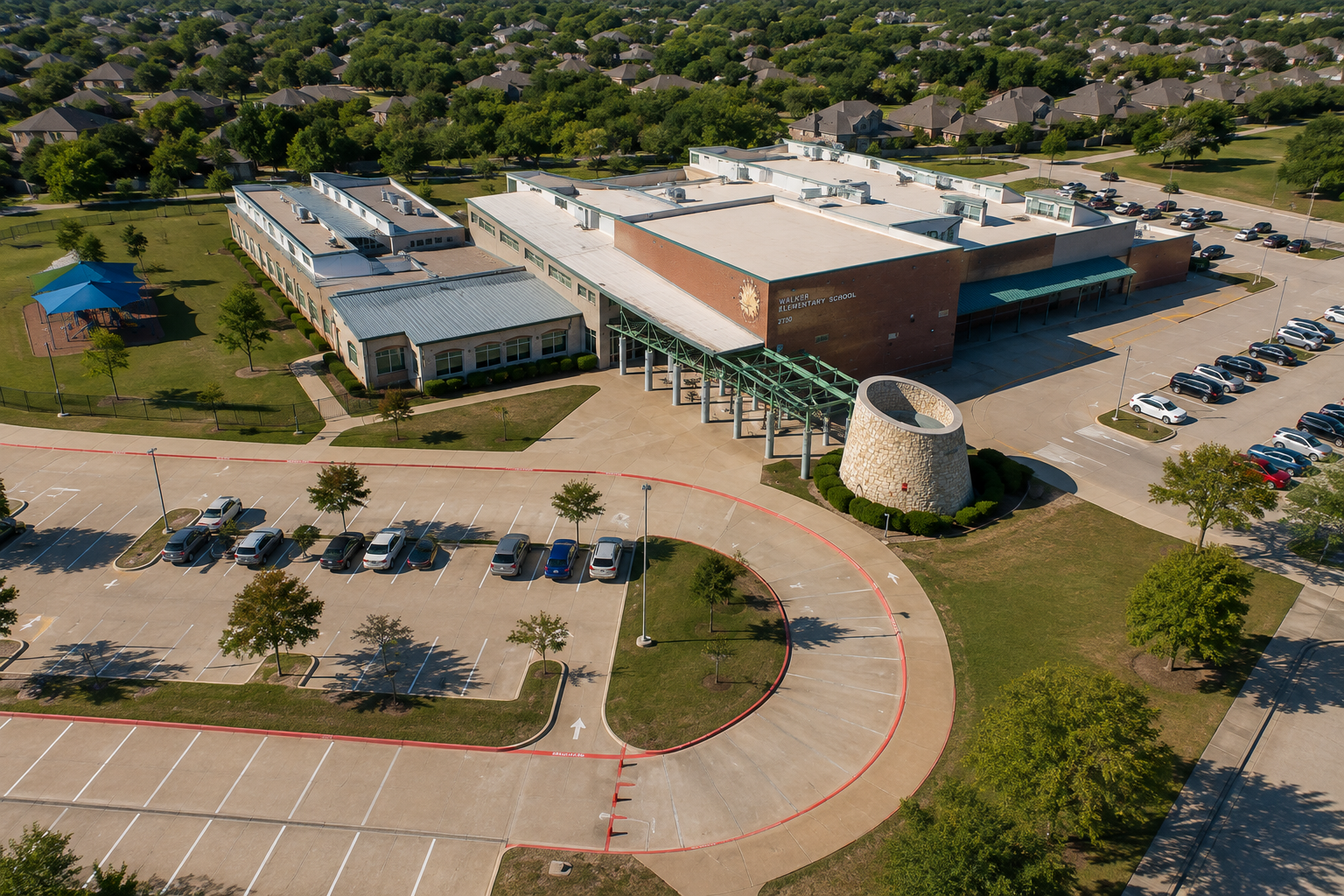 Aerial view of Walker Elementary School in McKinney, Texas, surrounded by residential neighborhoods and homes in McKinney ISD.