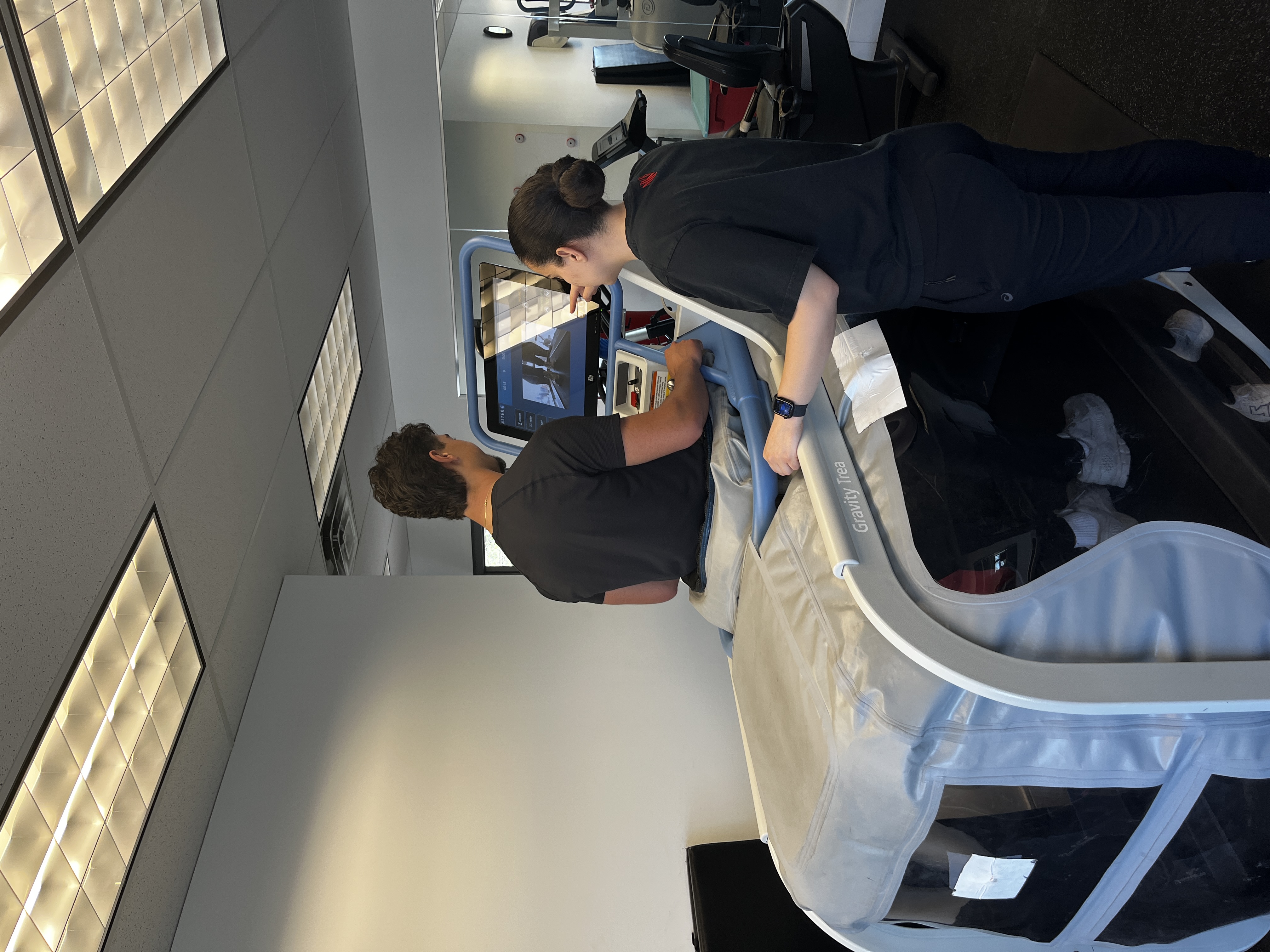 MyoHealth clinician with patient at the AlterG machine