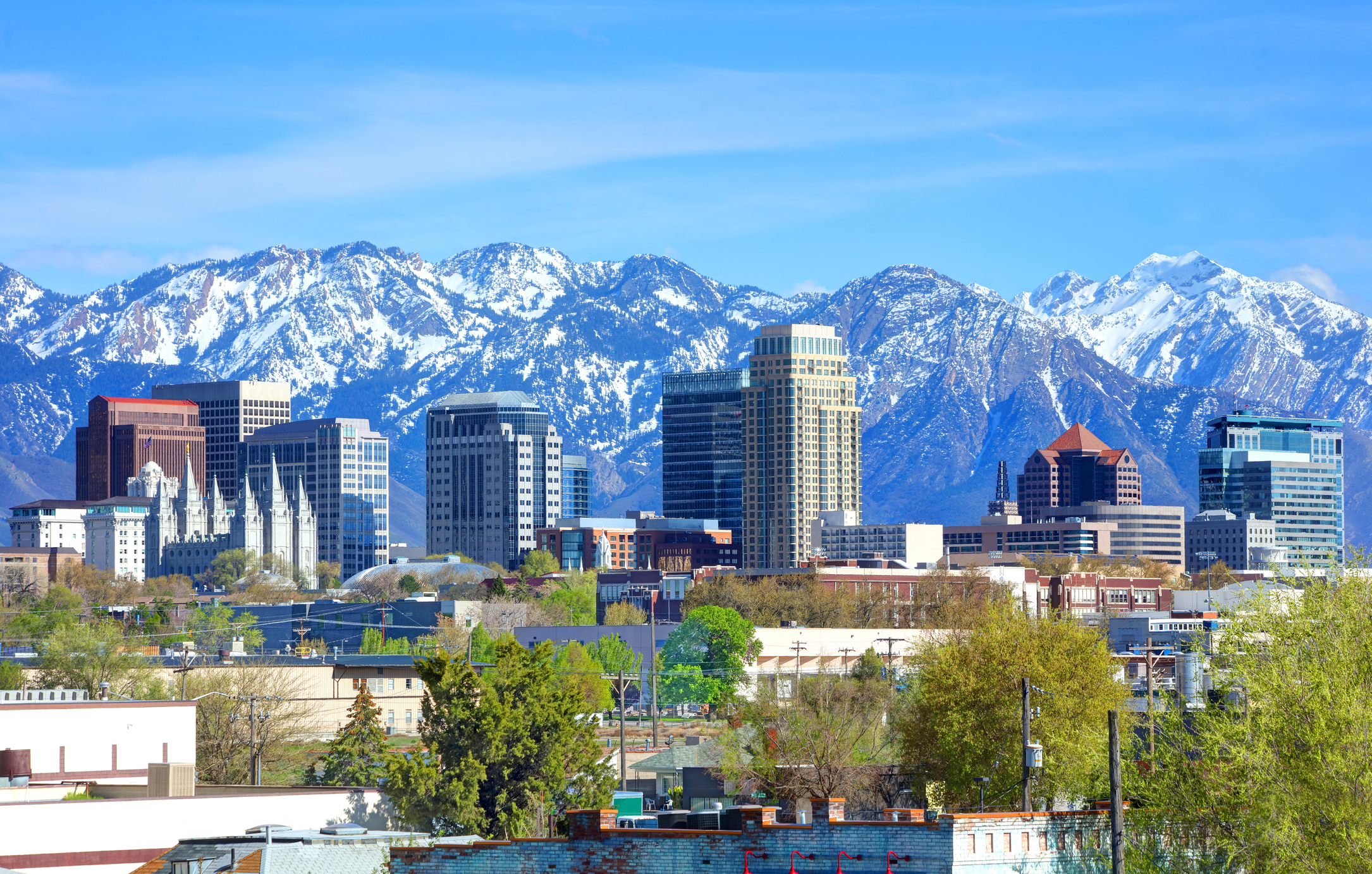 Utah city skyline with snowy mountains