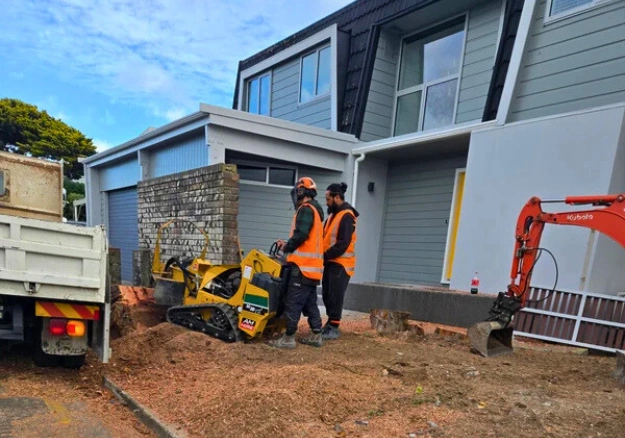 Hardscape construction team working on concrete driveway in Porirua