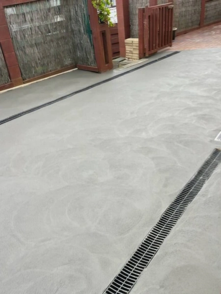 Smooth concrete driveway installation in Wellington suburb