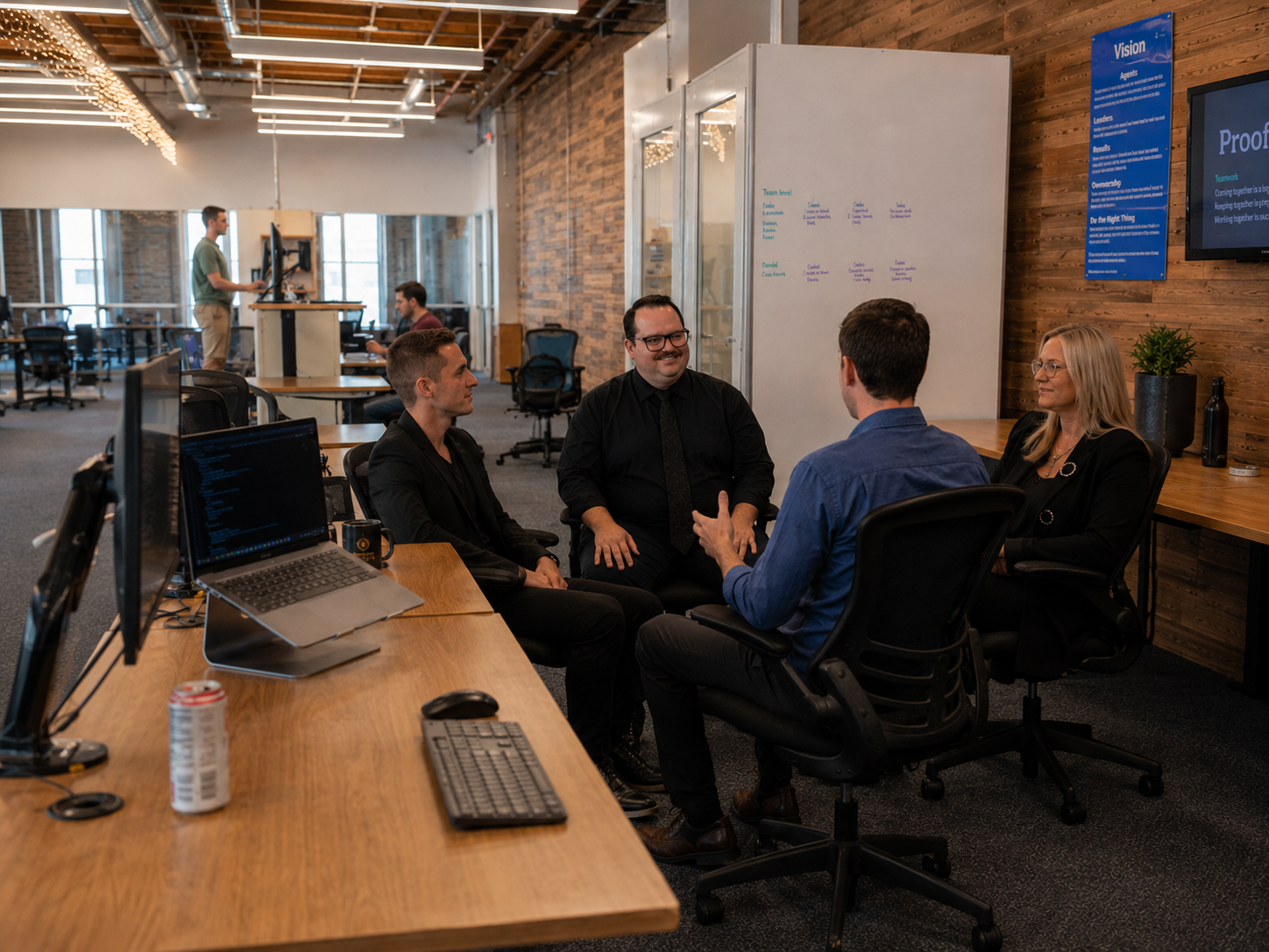 People in a light-filled architectural workspace
