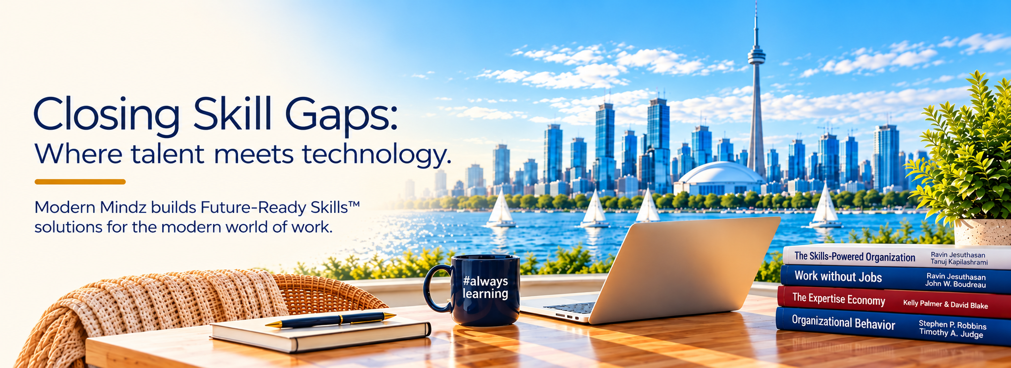 Laptop, books and an #alwayslearning mug overlooking the Toronto skyline.