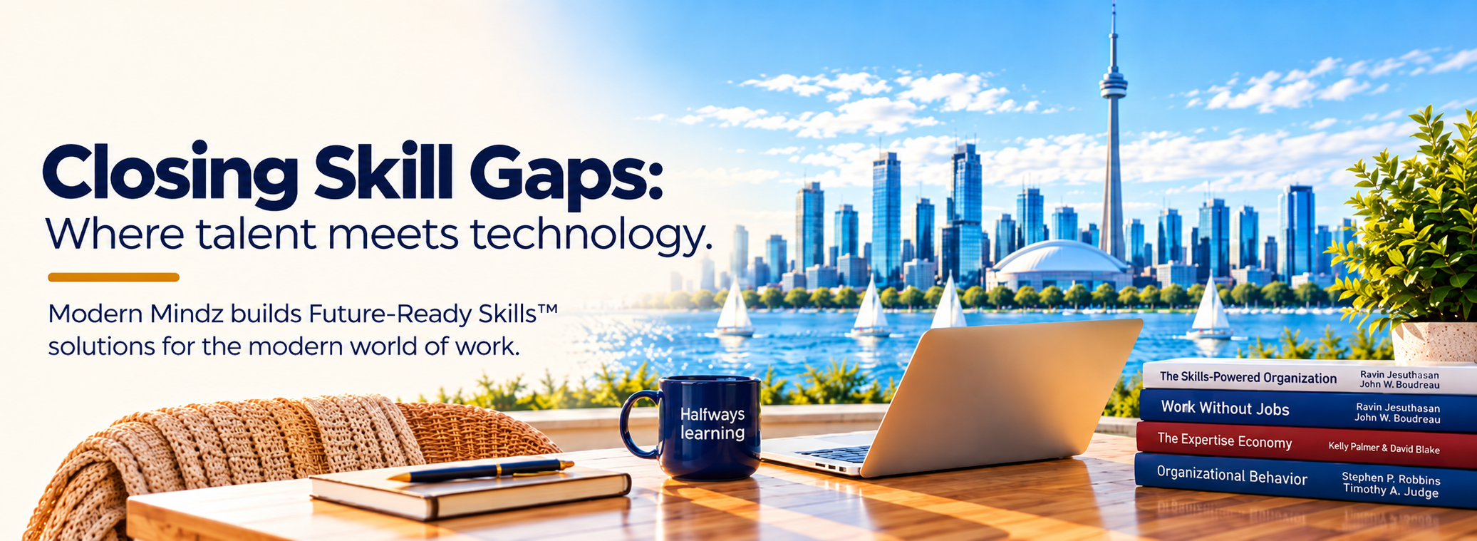 Laptop, books and an #alwayslearning mug overlooking the Toronto skyline.