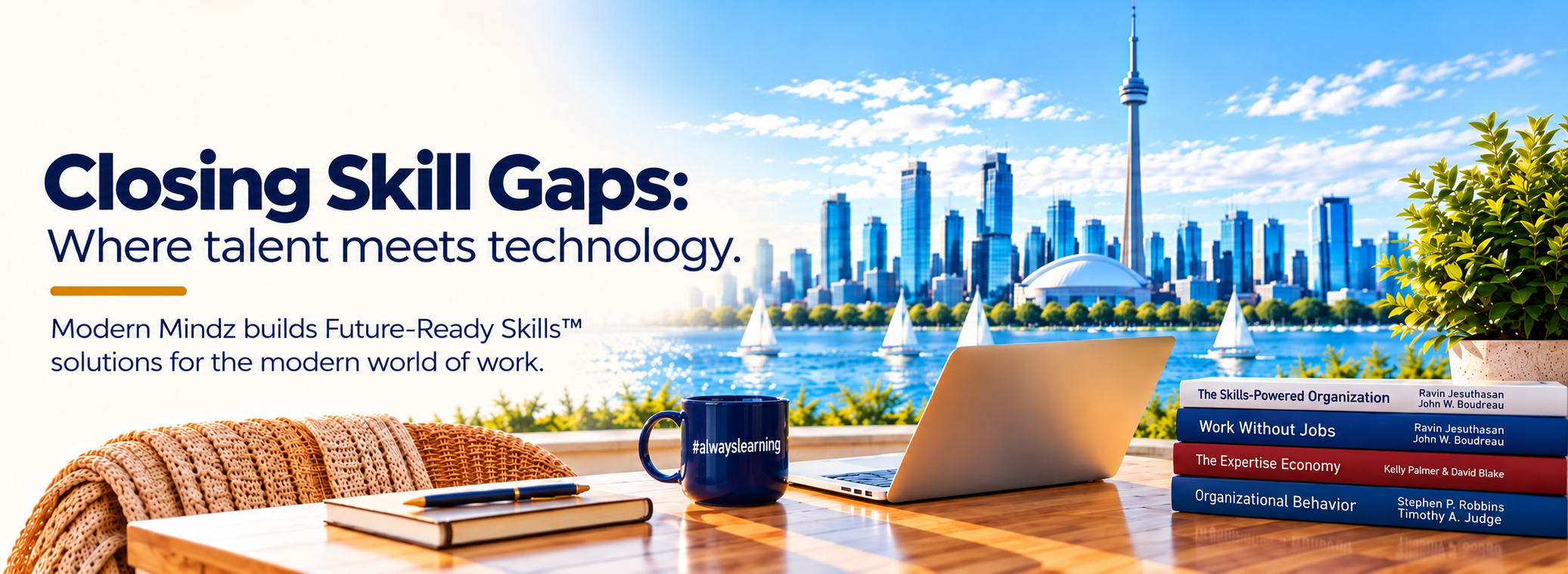 Laptop, books and an #alwayslearning mug overlooking the Toronto skyline.