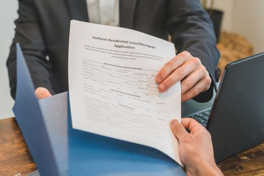 Prospective homebuyer organizing financial documents