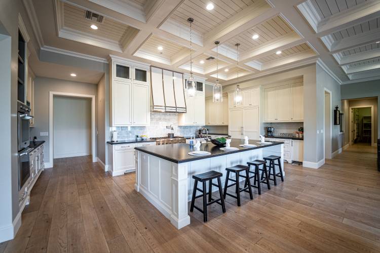 woman setting sheets on bed