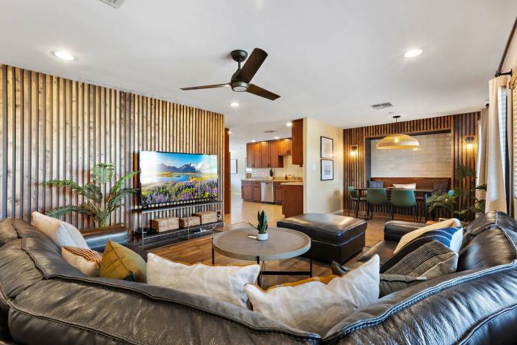 woman setting sheets on bed