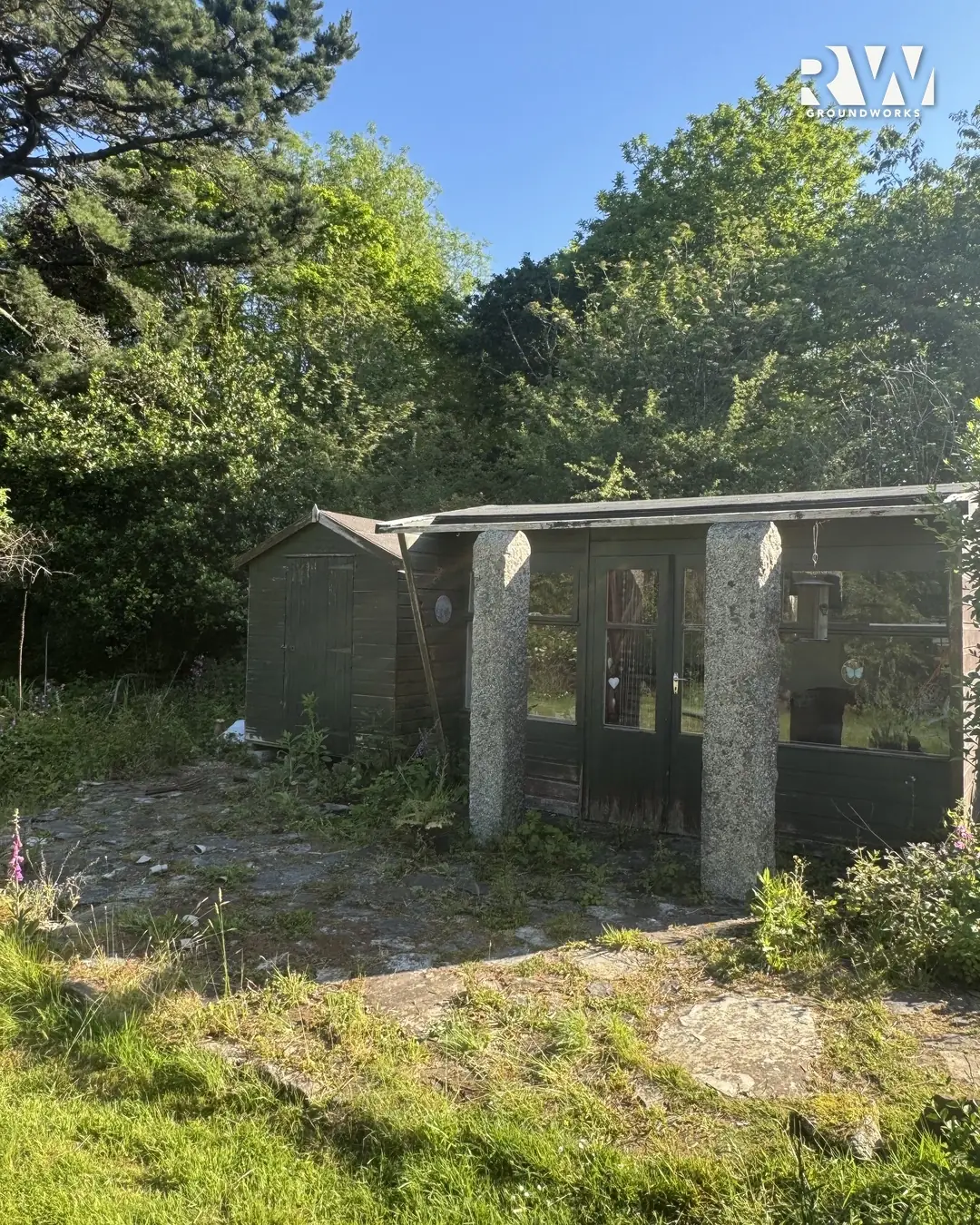 Wendron before: old granite-post carport in the overgrown garden