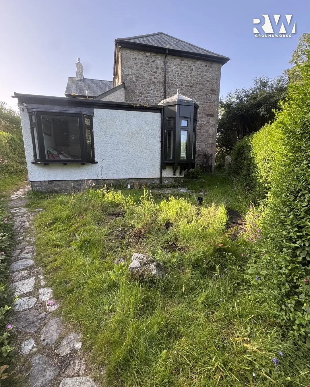 Wendron before: overgrown rear garden beside the hedge