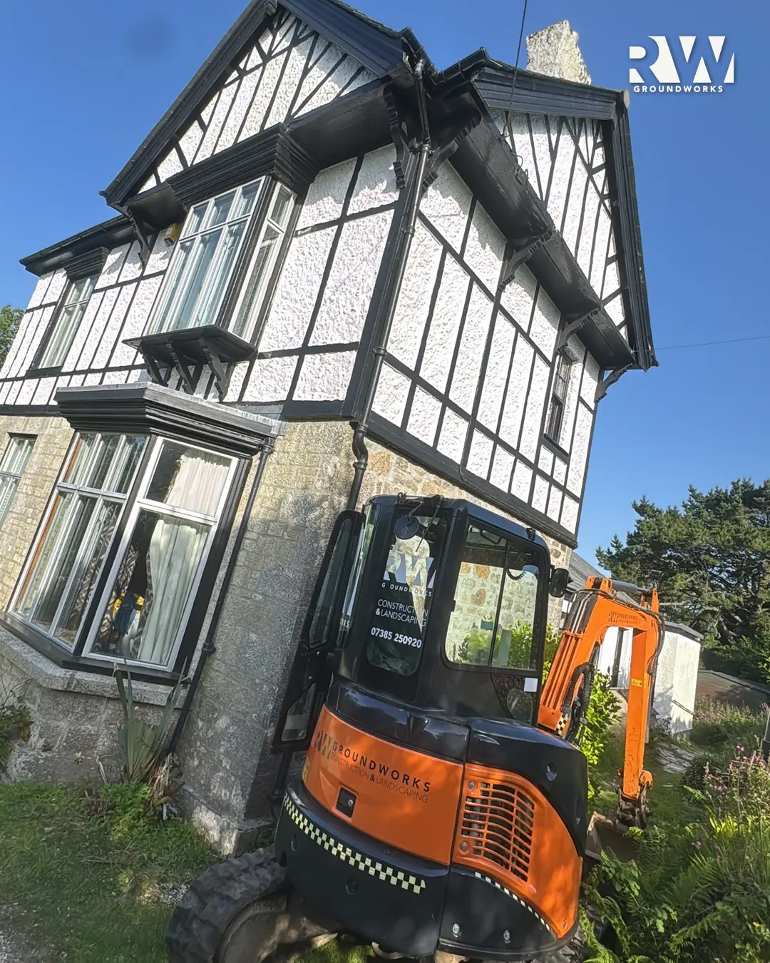 Our Hitachi mini digger working by the bay window in Wendron
