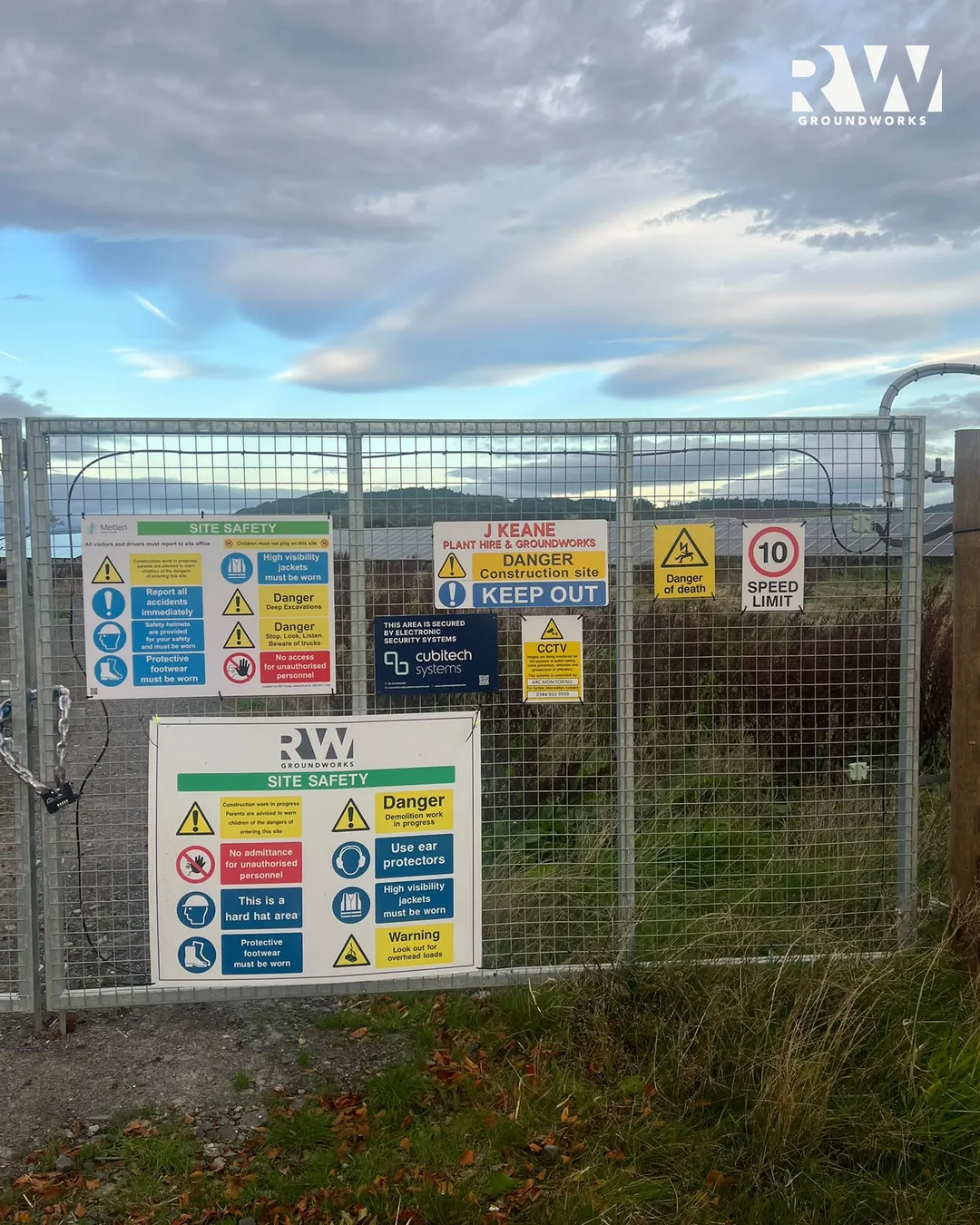 Solar farm site gate with safety signage