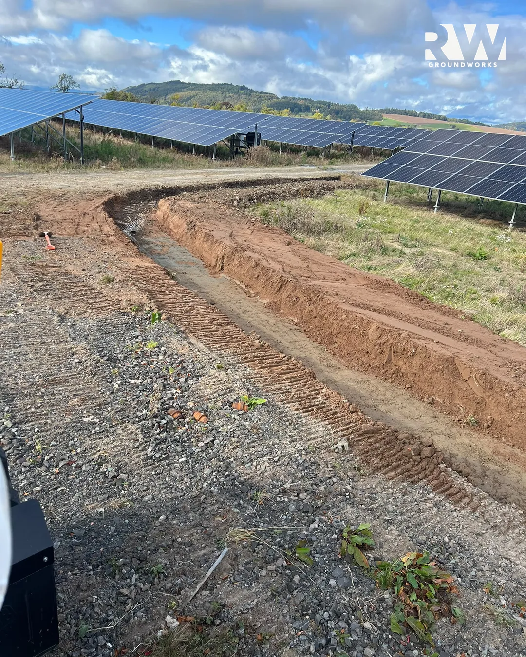 Drainage trench beside the solar panel rows