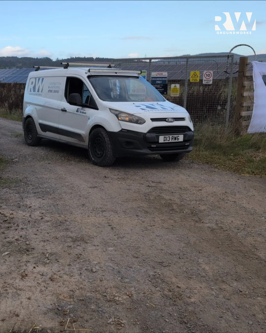 RW Groundworks van parked at the solar farm site gate