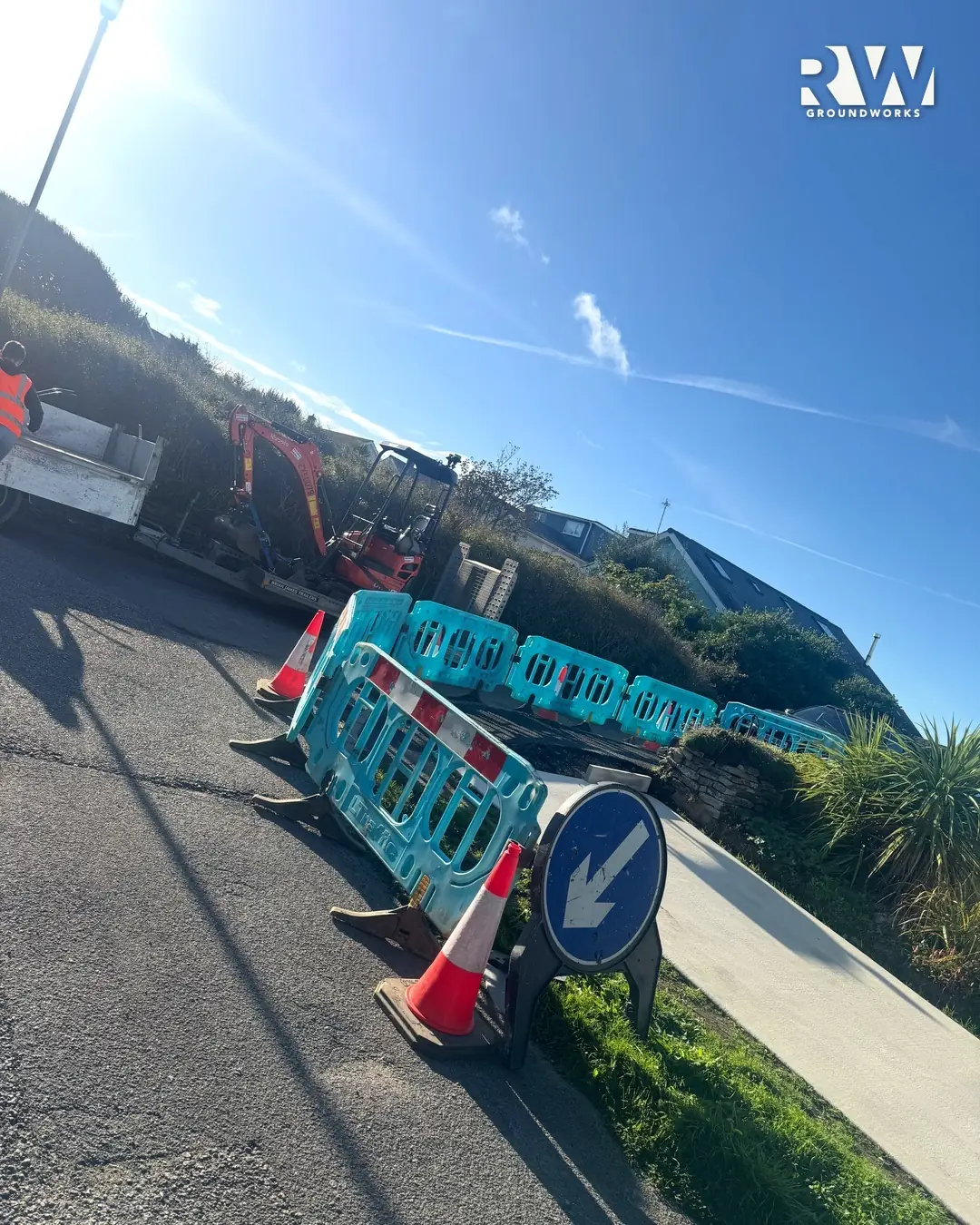 Pedestrian barriers, cones and a keep left sign around the dropped kerb works in Newquay