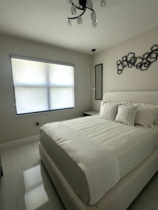Bedroom with Roller and Solar Shades
