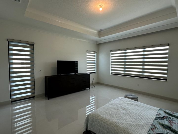 Bedroom with Zebra Roller Shades