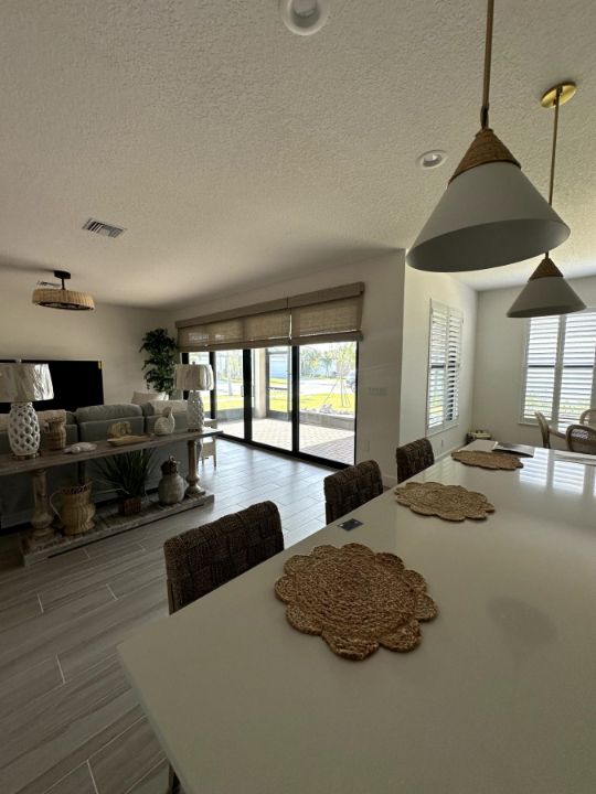 Kitchen and dining with Zebra Roller Shades