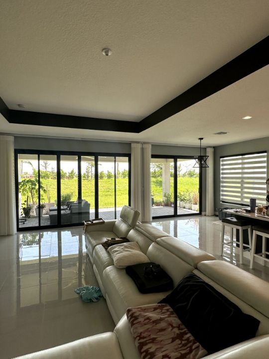 Great room with Zebra Roller Shades