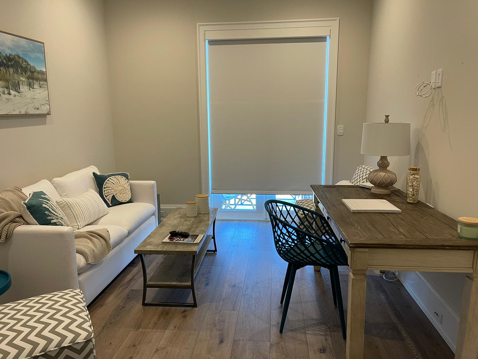 Roller shade in an open living room and home office