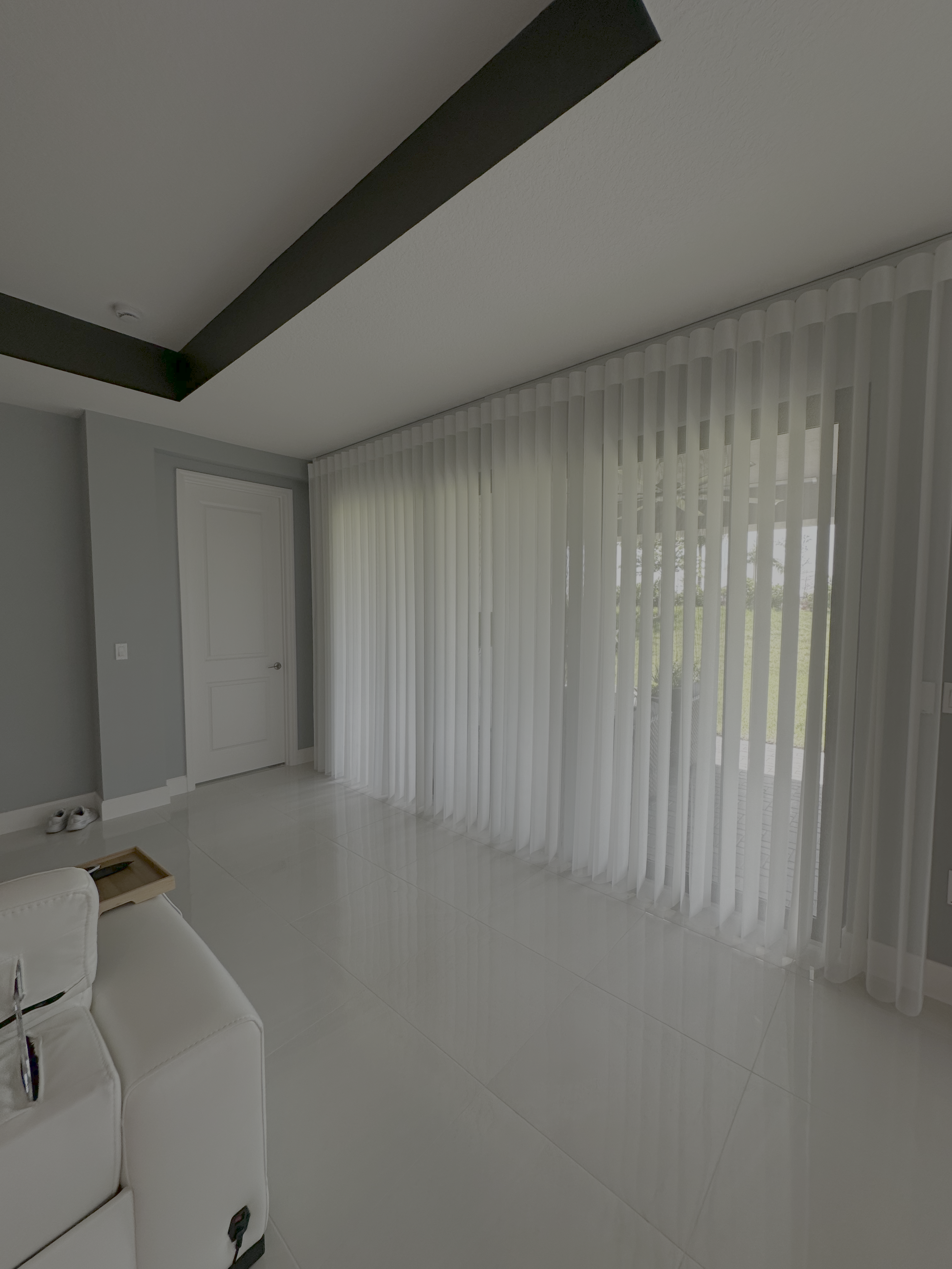 Glades Panels drawn across a wall of sliding doors in a living room