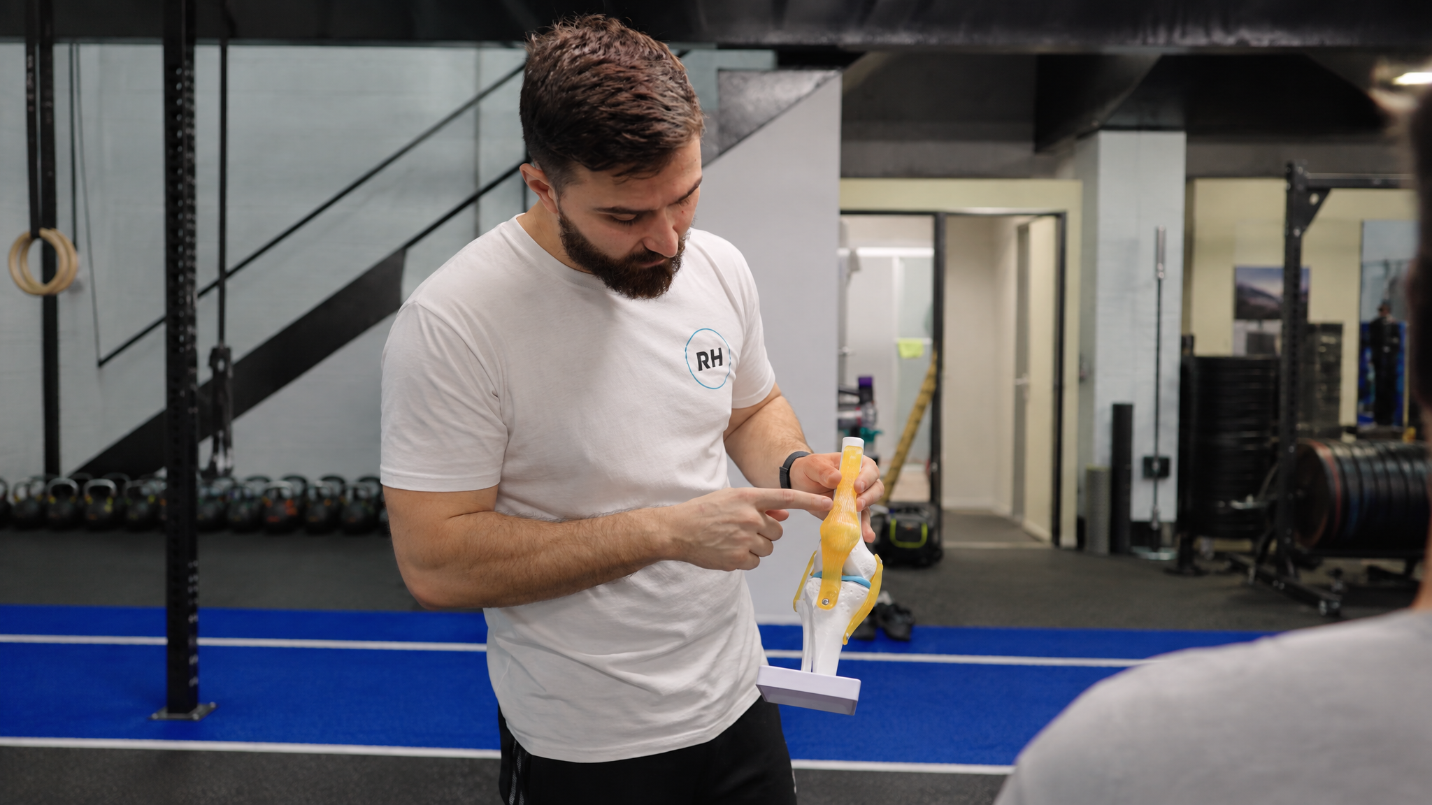 Chris explaining a knee model at Regen Health
