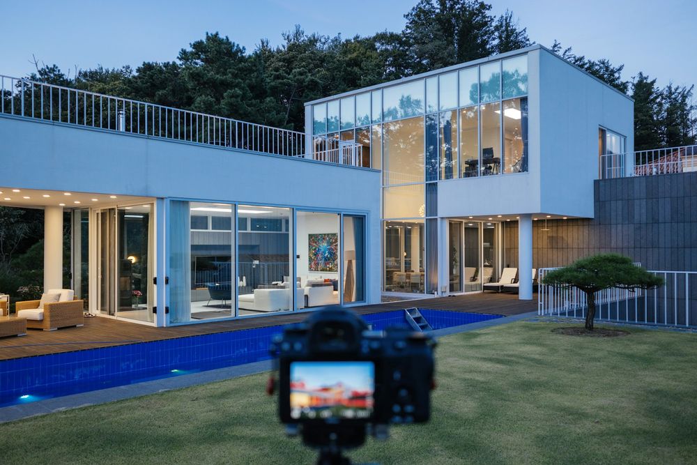 An agent reviewing a pricing report with clients