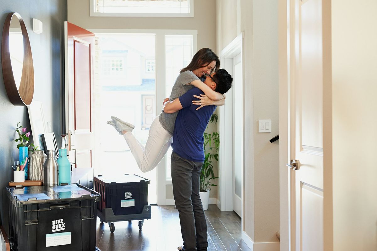 A couple celebrating in their new home